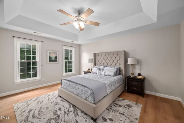 a bedroom with a large bed and a window