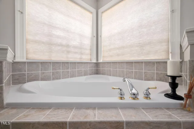 a bath tub sitting next to a bathroom