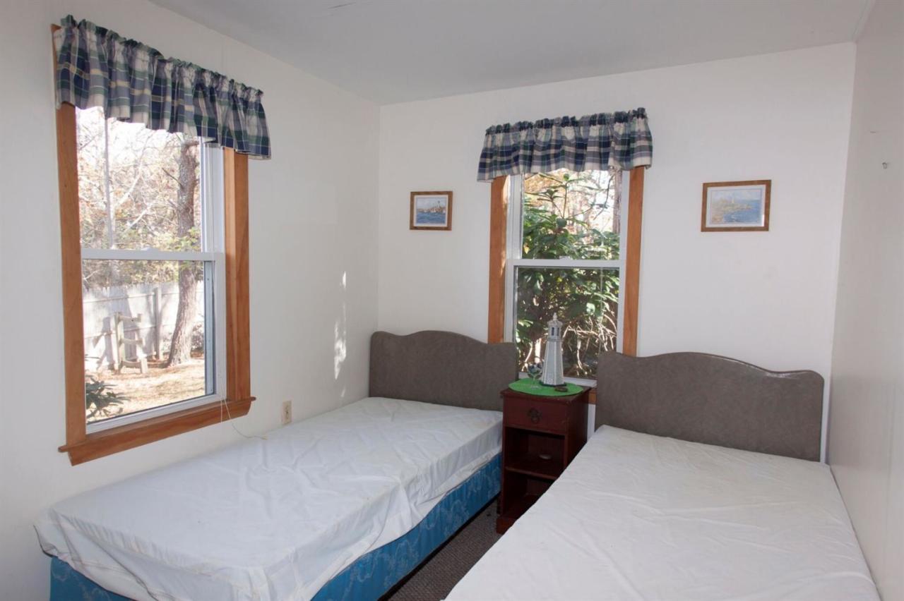 11 Hamblin Road Mashpee, MA 02649 - Photo 10 of 18 a bedroom with a bed and a window