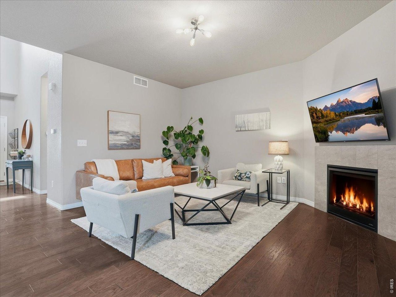 1766 Ruddlesway Drive Windsor, CO 80550 - Photo 2 of 50 Living Room With Gas Fireplace