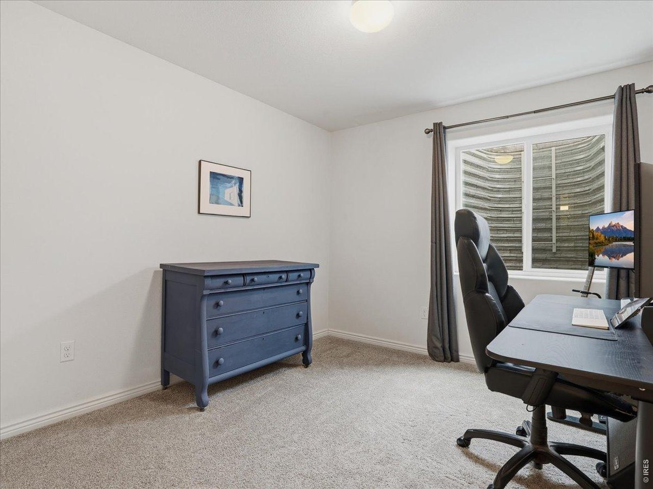 1766 Ruddlesway Drive Windsor, CO 80550 - Photo 35 of 50 a view of a workspace with furniture and a window
