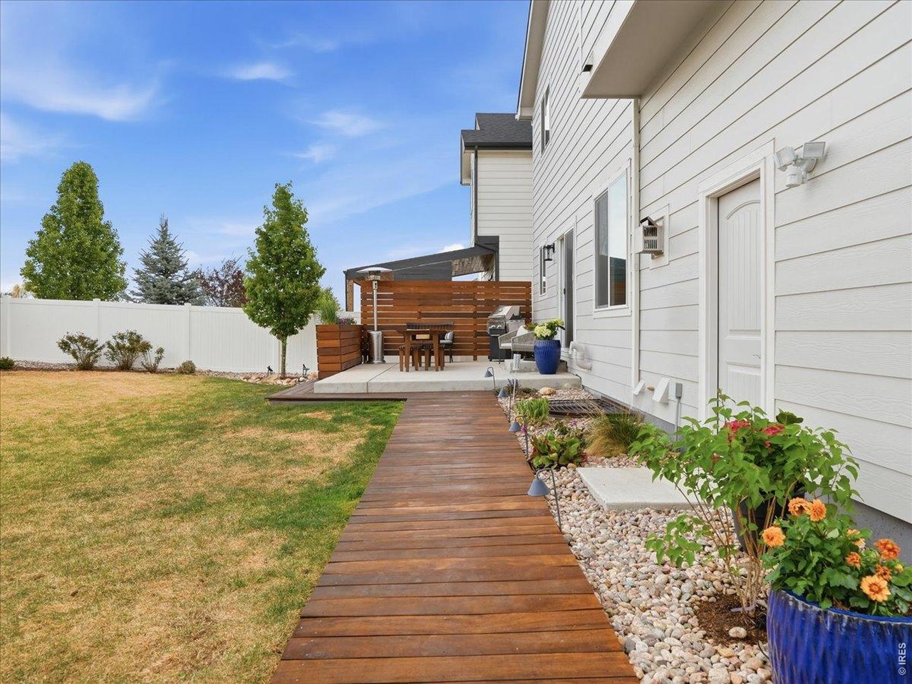 1766 Ruddlesway Drive Windsor, CO 80550 - Photo 37 of 50 Teak Wood Path to Hot Tub