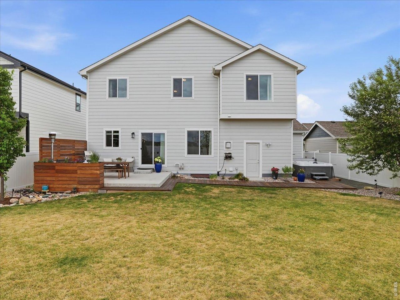 1766 Ruddlesway Drive Windsor, CO 80550 - Photo 48 of 50 a view of a house with swimming pool and a porch