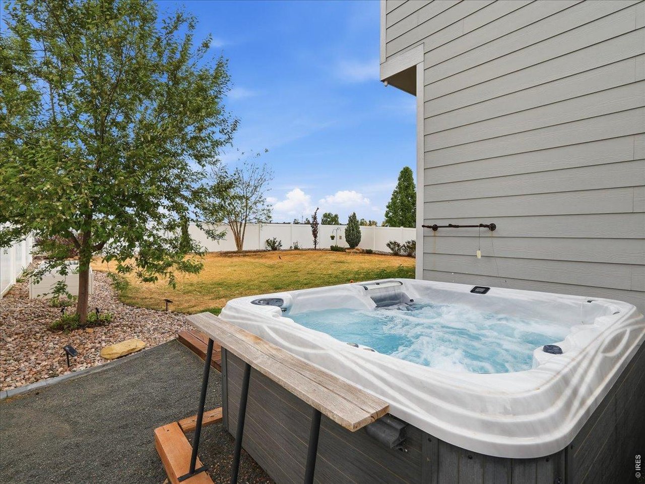 1766 Ruddlesway Drive Windsor, CO 80550 - Photo 8 of 50 Included Hot Tub!
