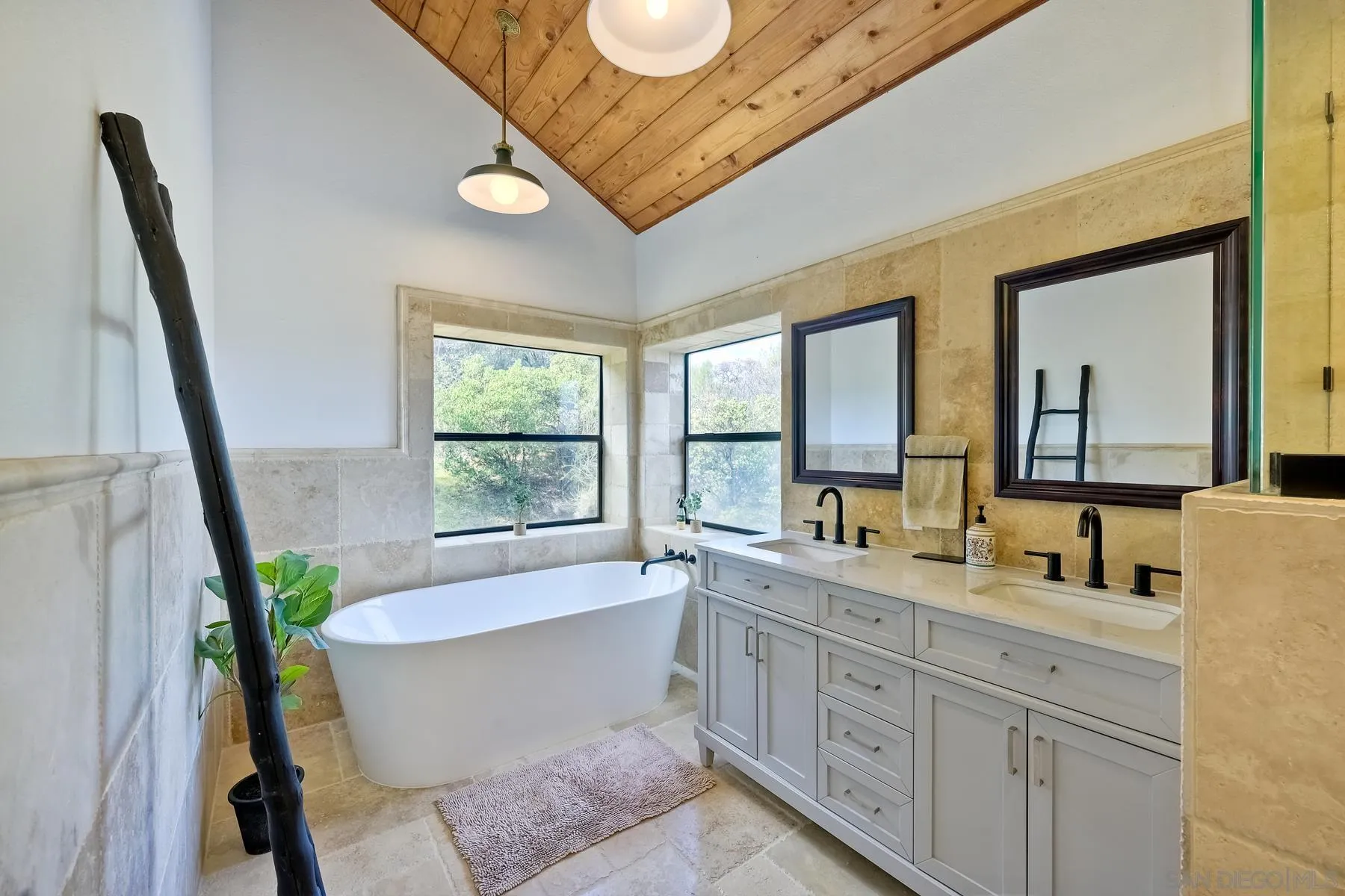 20570 Sycamore Springs Road Jamul, CA 91935 - Photo 27 of 39 a spacious bathroom with a granite countertop tub sink and mirror
