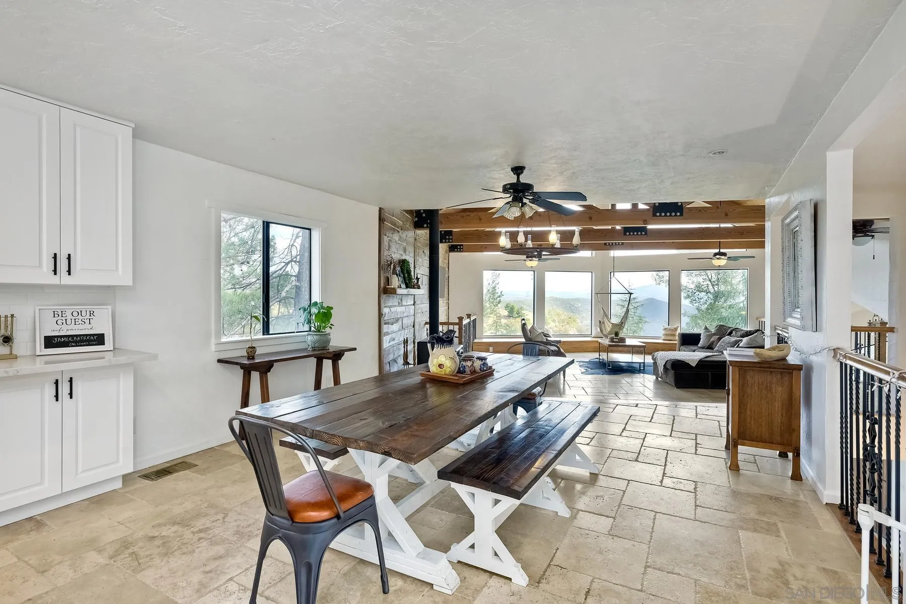 20570 Sycamore Springs Road Jamul, CA 91935 - Photo 5 of 39 a view of a dining room with furniture large windows and wooden floor