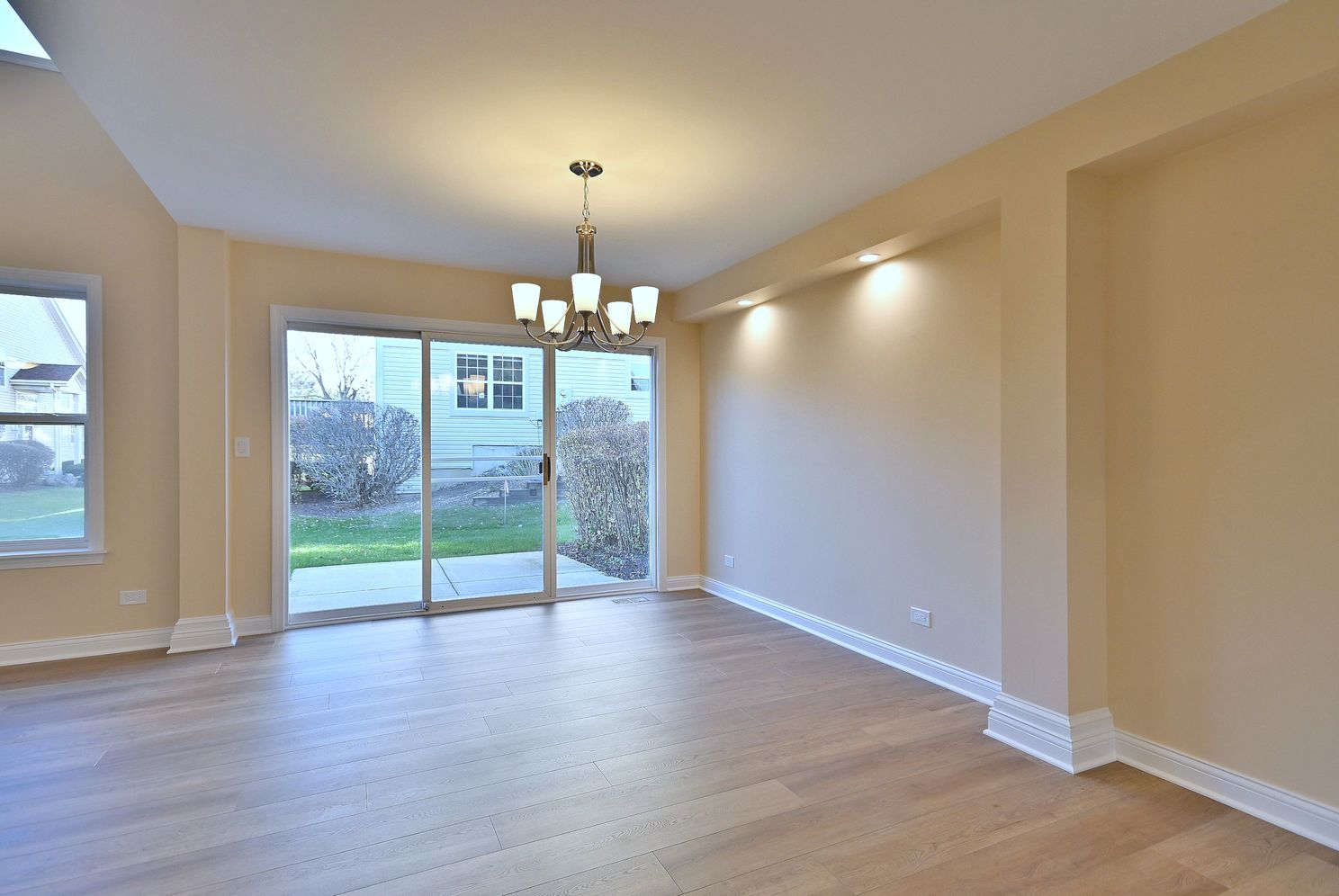 3208 Raphael Court St. Charles, IL 60175 - Photo 13 of 47 a view of an empty room with glass door and glass door