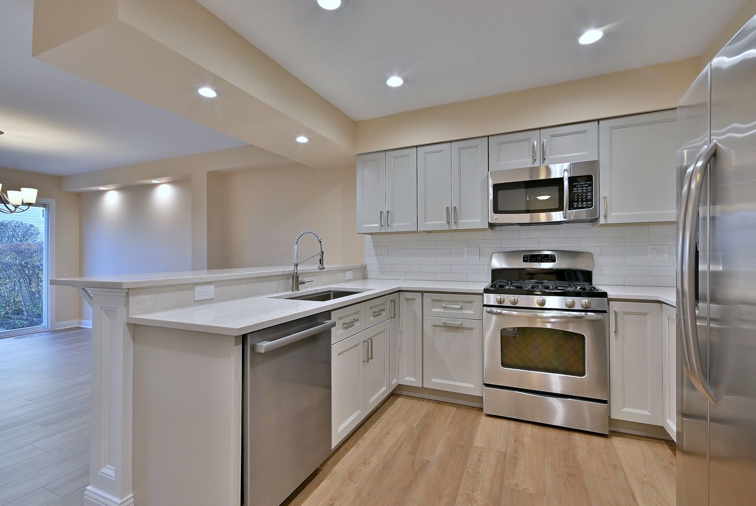 3208 Raphael Court St. Charles, IL 60175 - Photo 15 of 47 a kitchen with a sink stove and refrigerator