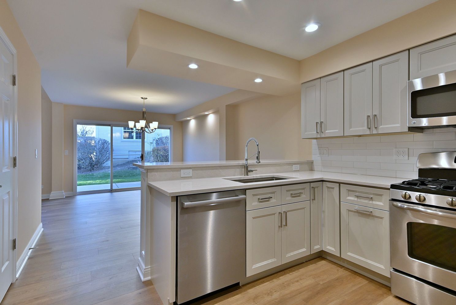 3208 Raphael Court St. Charles, IL 60175 - Photo 17 of 47 a kitchen with a sink stove and cabinets