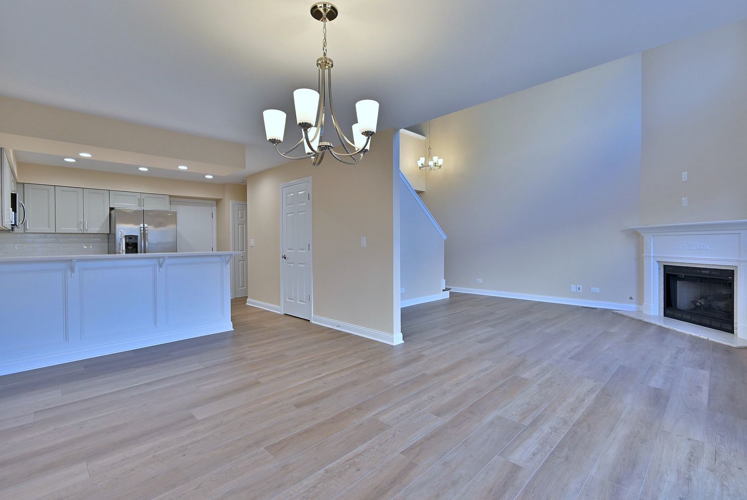 3208 Raphael Court St. Charles, IL 60175 - Photo 21 of 47 a view of a room with wooden floor and kitchen view
