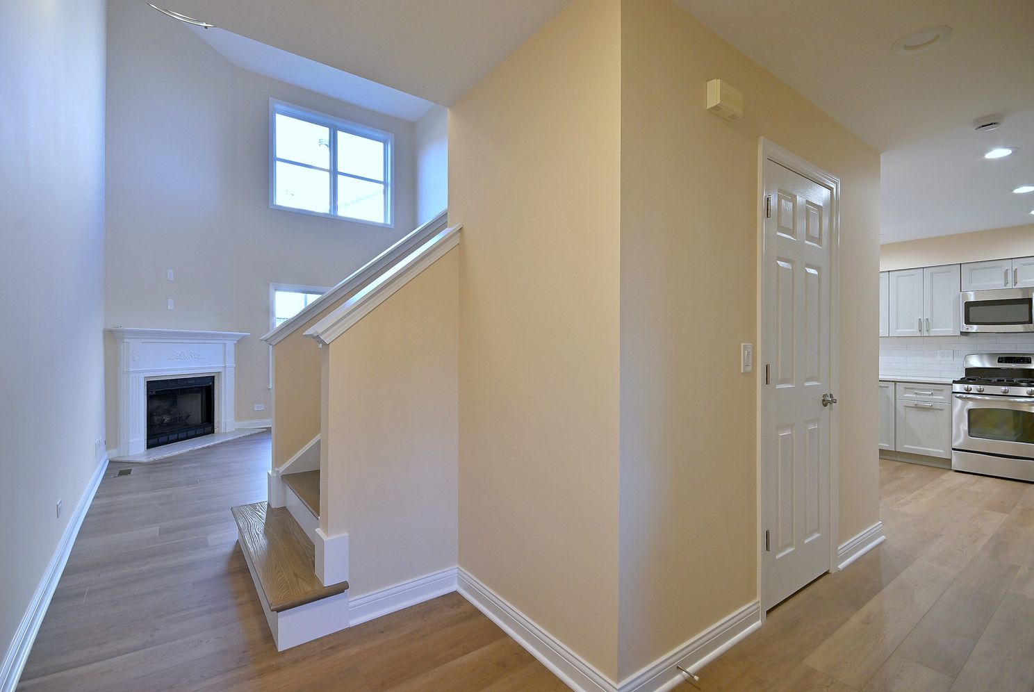3208 Raphael Court St. Charles, IL 60175 - Photo 25 of 47 a view of a hallway with wooden floor and staircase