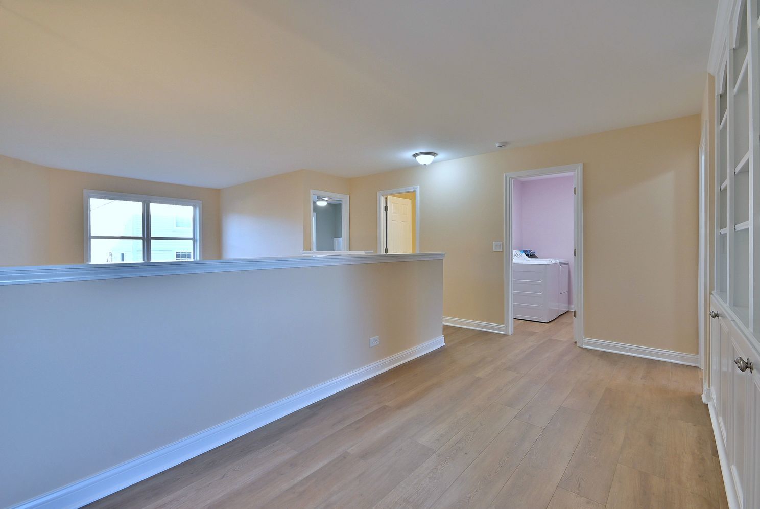 3208 Raphael Court St. Charles, IL 60175 - Photo 28 of 47 an empty room with wooden floor and windows