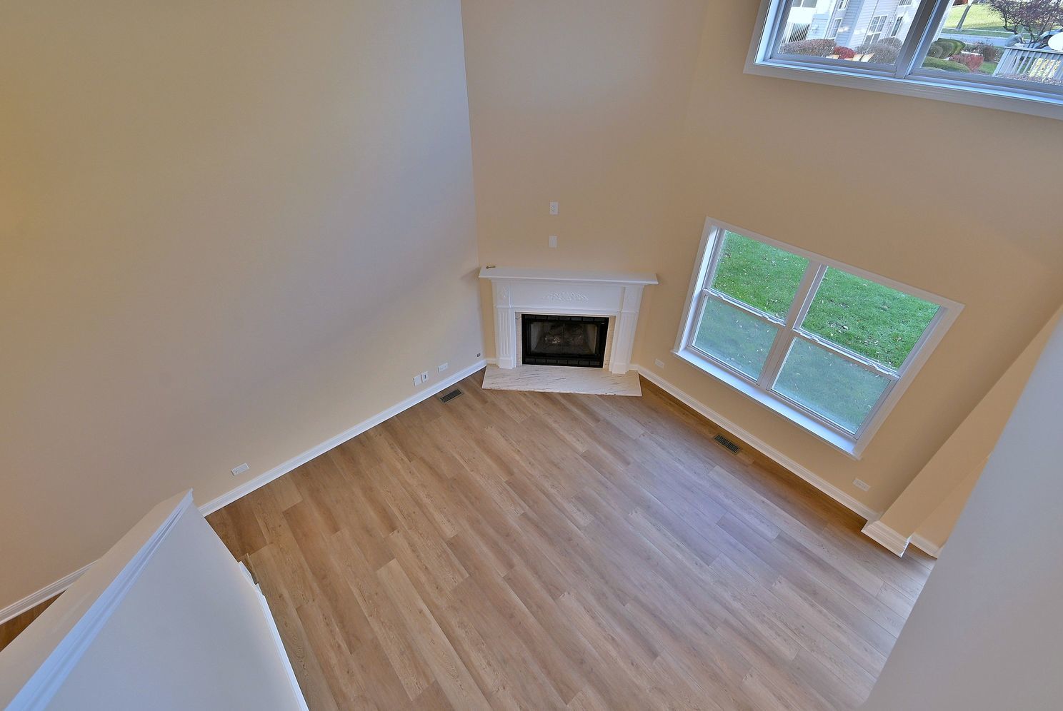 3208 Raphael Court St. Charles, IL 60175 - Photo 32 of 47 a view of an empty room with wooden floor and a window