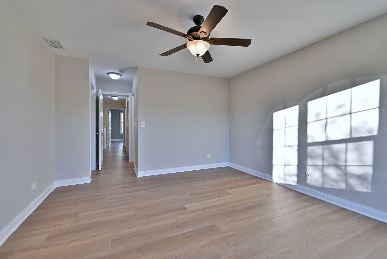 3208 Raphael Court St. Charles, IL 60175 - Photo 34 of 47 wooden floor in an empty room with a window