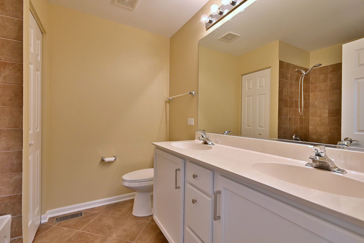 3208 Raphael Court St. Charles, IL 60175 - Photo 36 of 47 a bathroom with a granite countertop sink a toilet and a mirror
