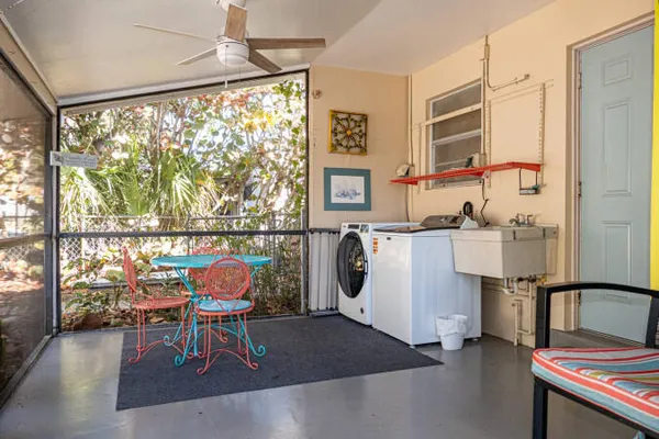 a balcony with chairs and outdoor view