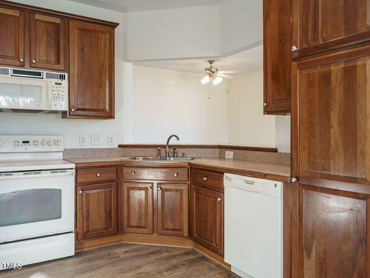 600 Competition Road Raleigh, NC 27603 - Photo 14 of 42 a kitchen with stainless steel appliances granite countertop a sink stove and refrigerator