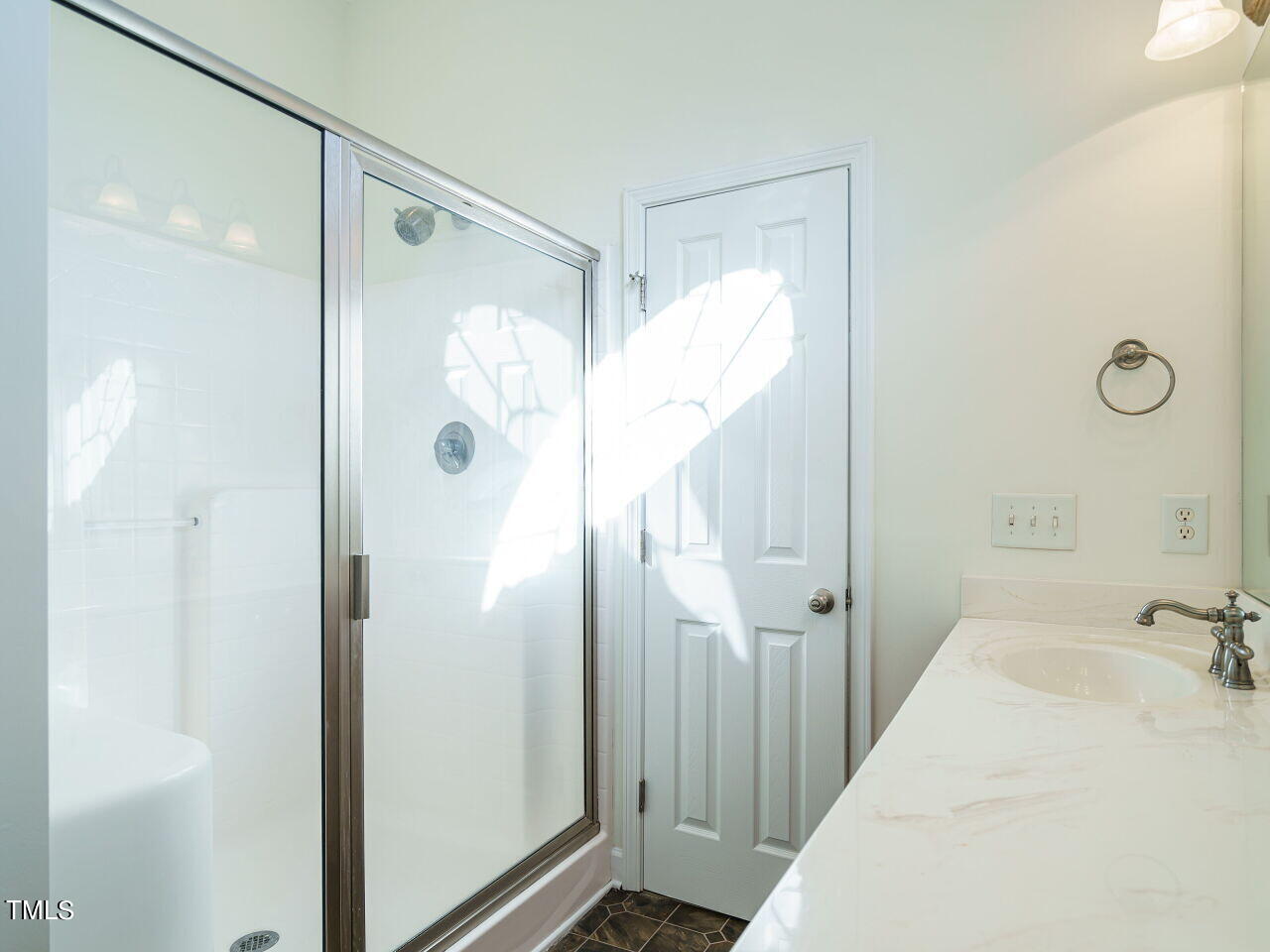 600 Competition Road Raleigh, NC 27603 - Photo 20 of 42 a bathroom with a tub and shower