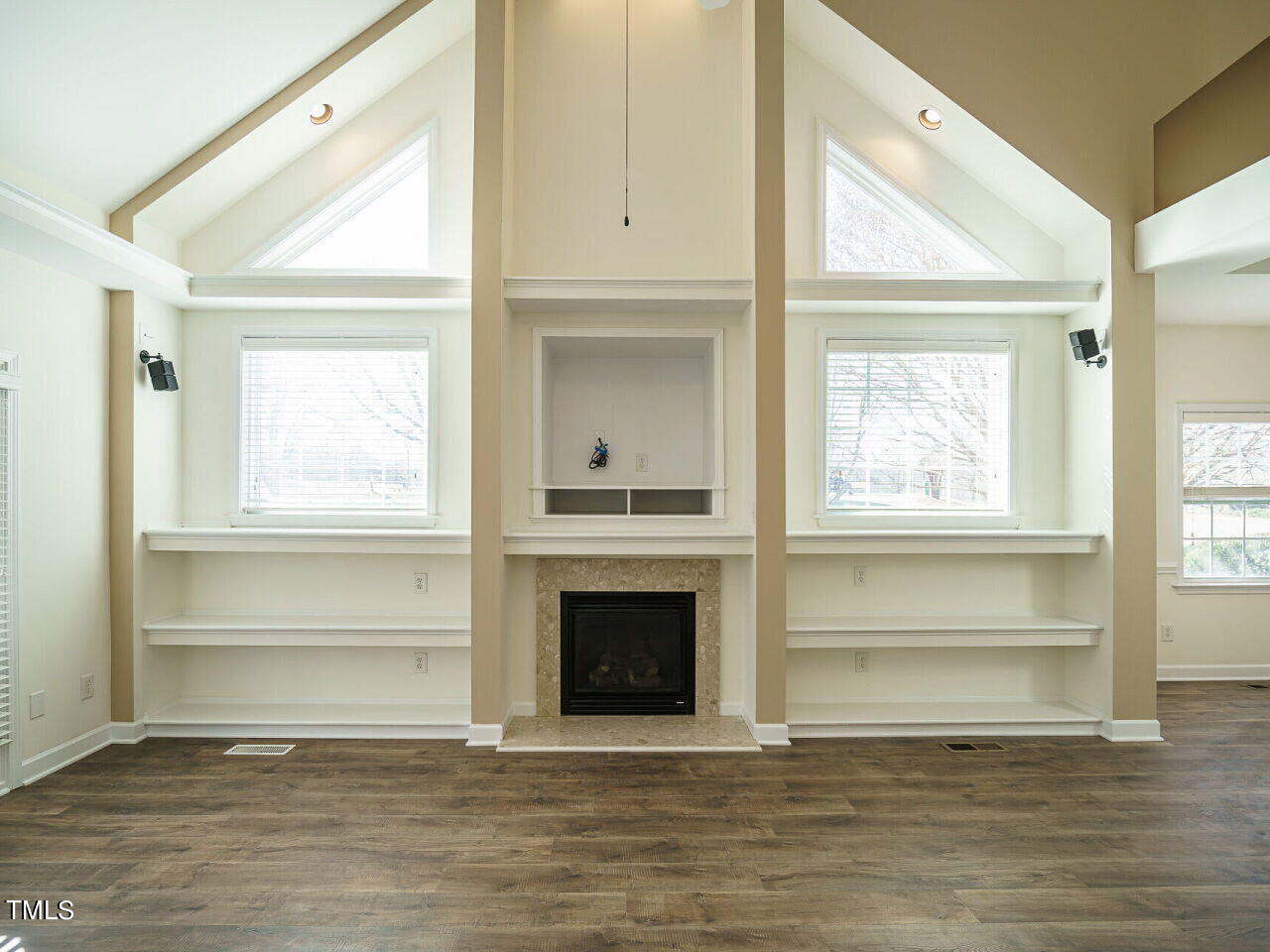 600 Competition Road Raleigh, NC 27603 - Photo 6 of 42 a view of an empty room with a fireplace and a window