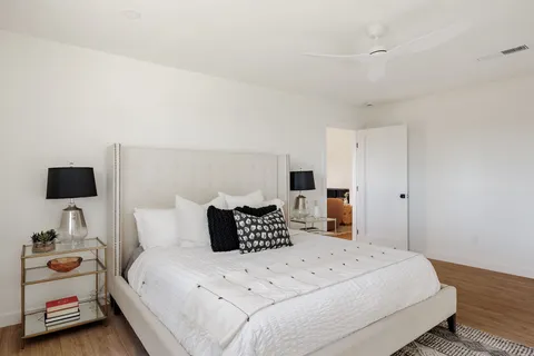 a bedroom with a bed and a tv