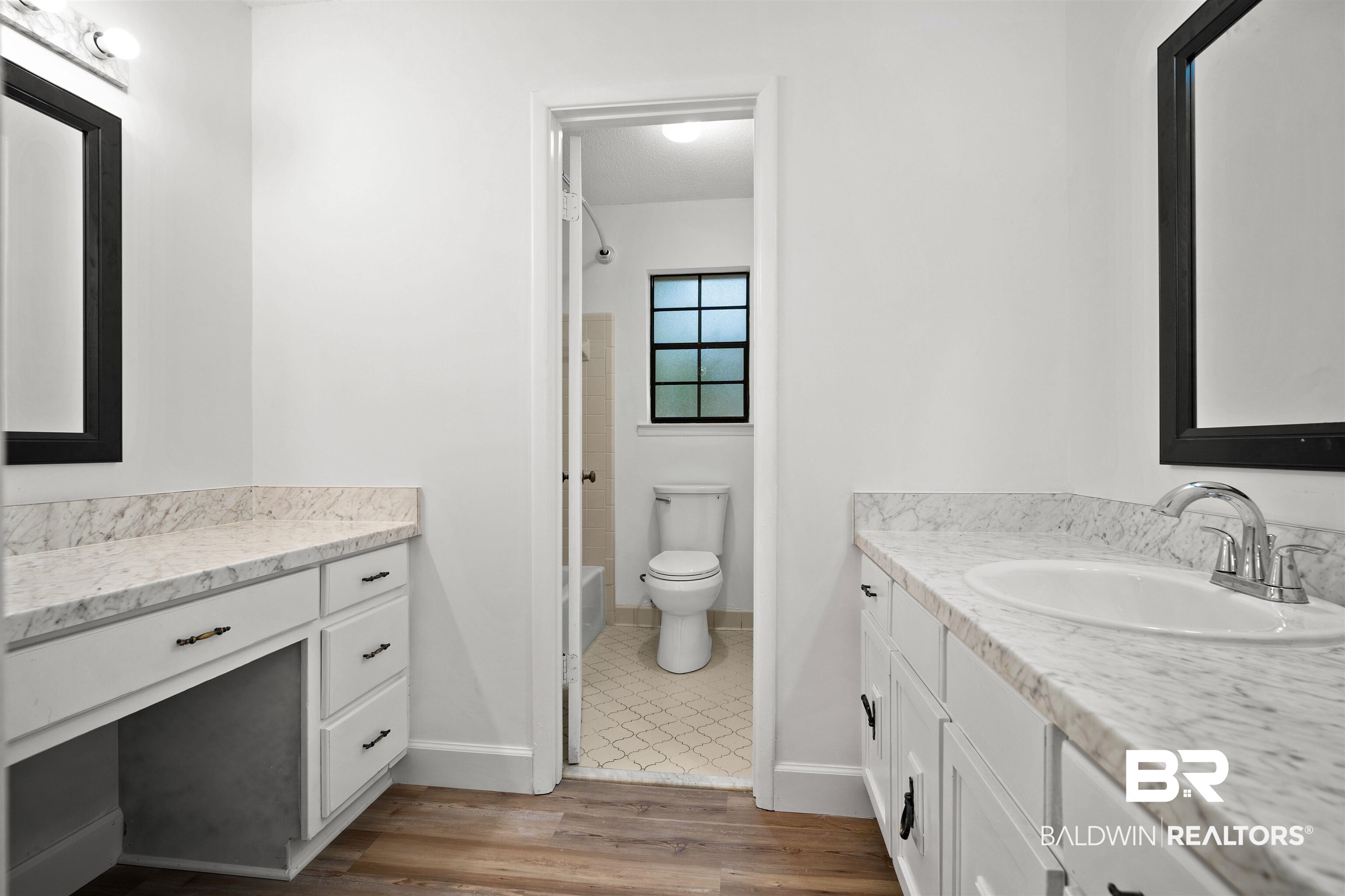 6521 Valor Court Mobile, AL 36618 - Photo 23 of 29 Bathroom featuring hardwood / wood-style flooring, vanity, and toilet