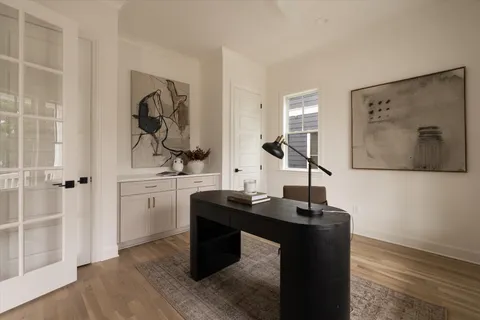 a kitchen with a table chairs stove and microwave