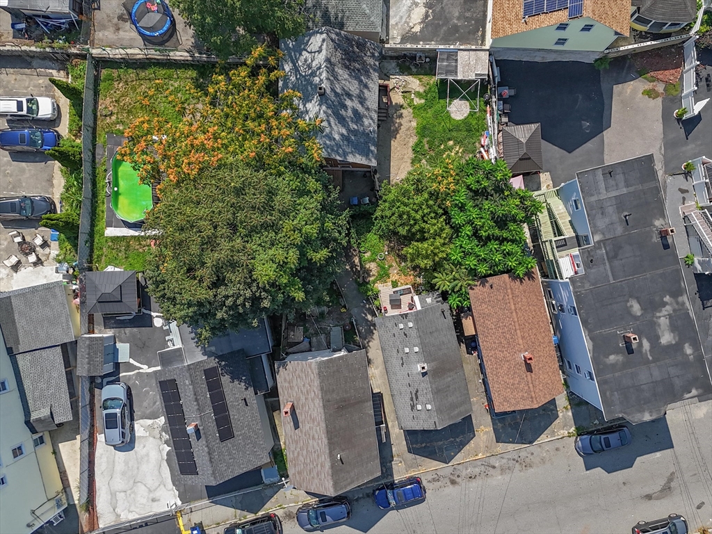 58-64 Railroad Street Lawrence, MA 01841 - Photo 5 of 9 an aerial view of multiple houses with yard