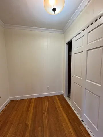 a view of small space with wooden floor