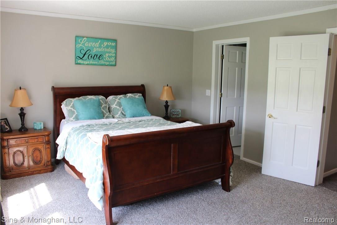 26523 Prinz Road Richmond, MI 48062 - Photo 29 of 61 VIEW OF MASTER BEDROOM ENTRY DOOR AND DOOR LEADING TO MASTER BATH EN SUITE
