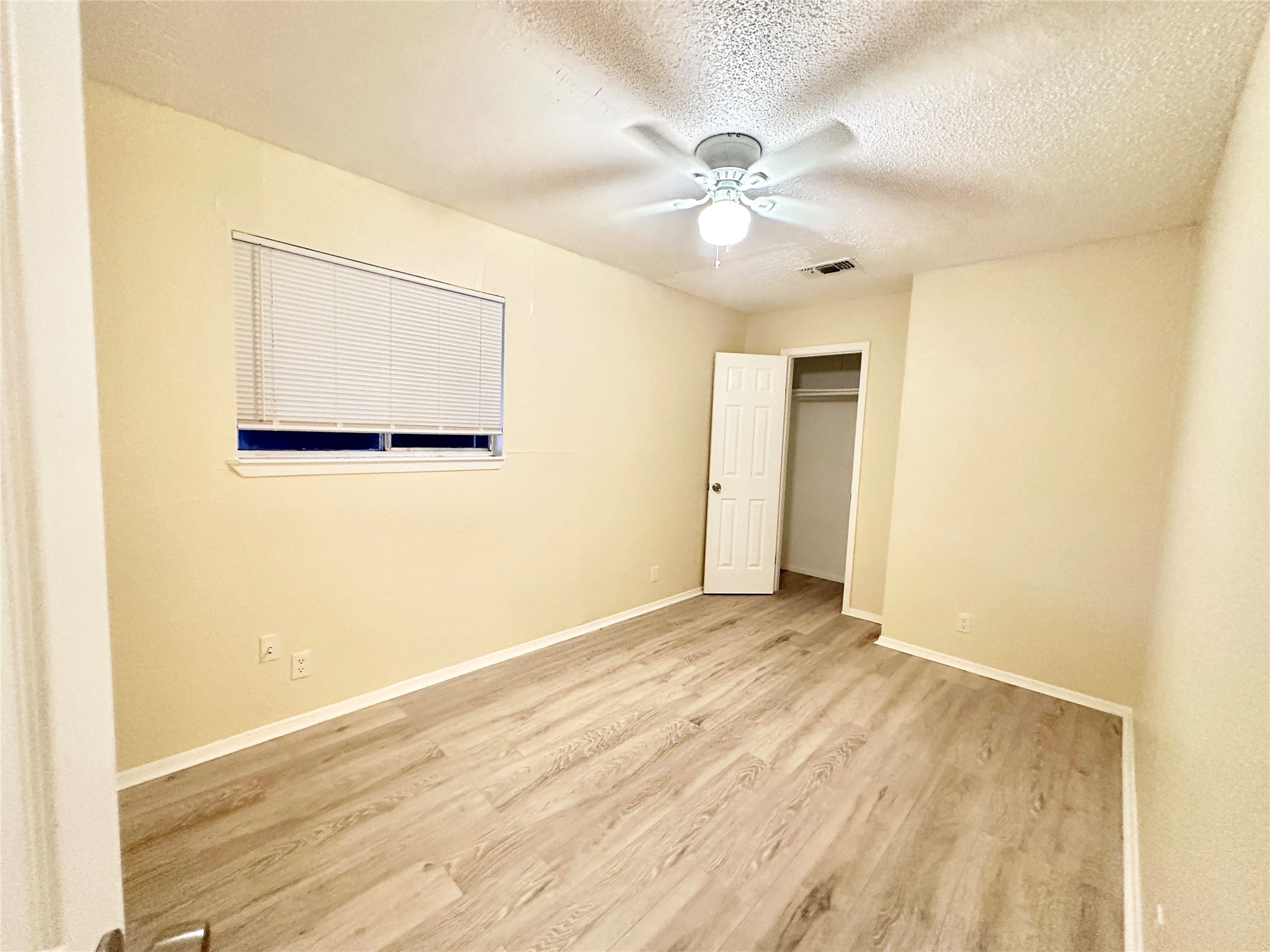 4302 Scottsdale Road, Unit A Austin, TX 78721 - Photo 17 of 30 a view of an empty room with wooden floor