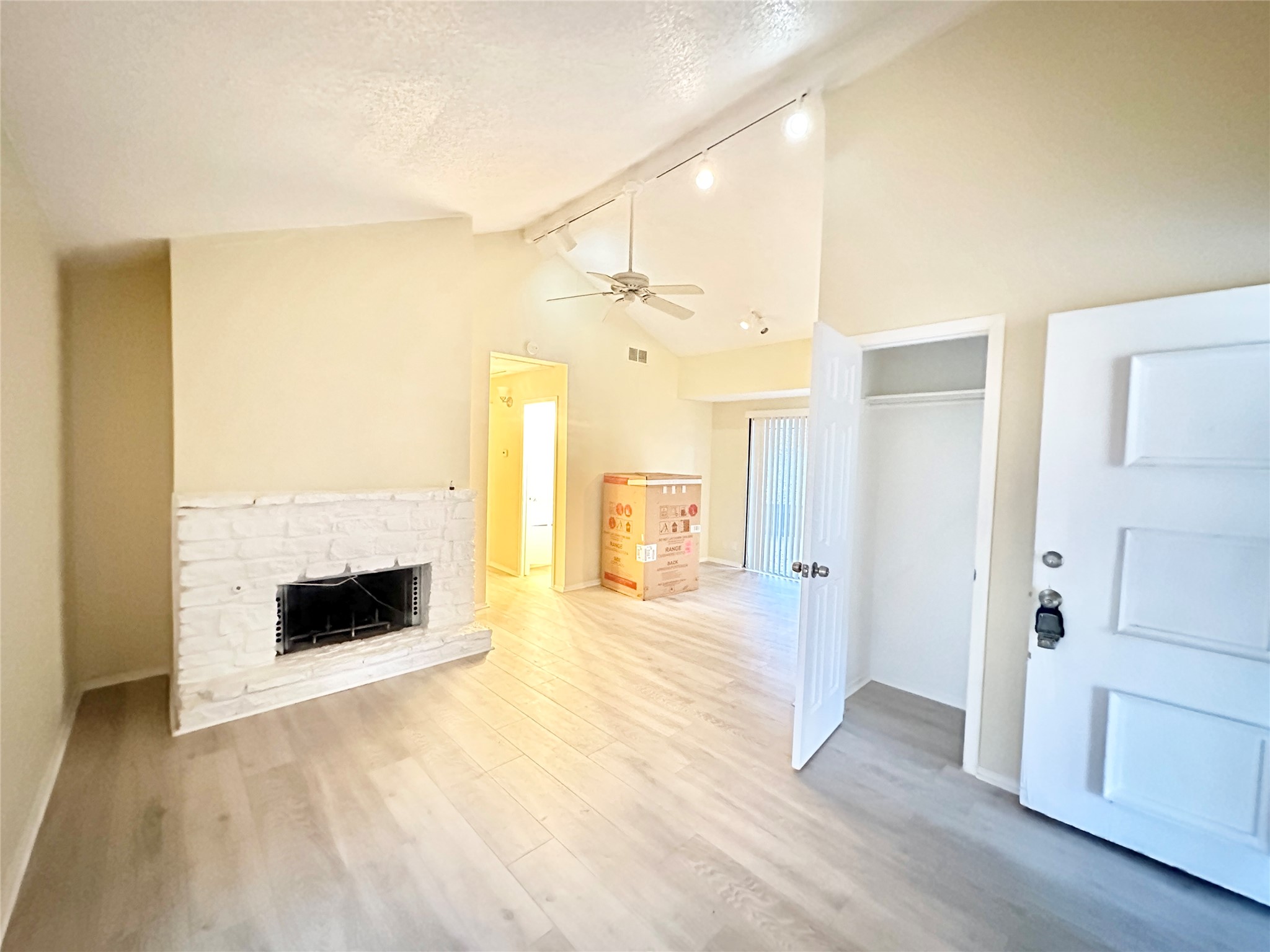 4302 Scottsdale Road, Unit A Austin, TX 78721 - Photo 6 of 30 a view of a livingroom with a fireplace and wooden floor