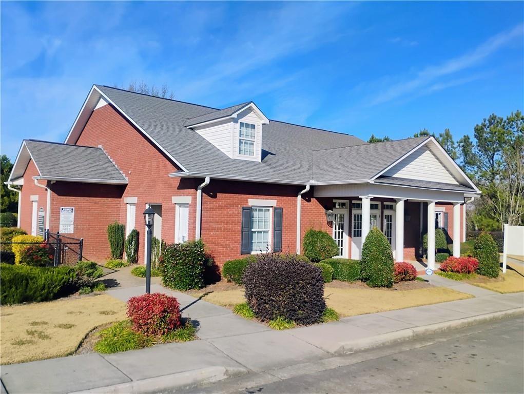 156 Millers Lane Calhoun, GA 30701 - Photo 24 of 26 a front view of a house with garden
