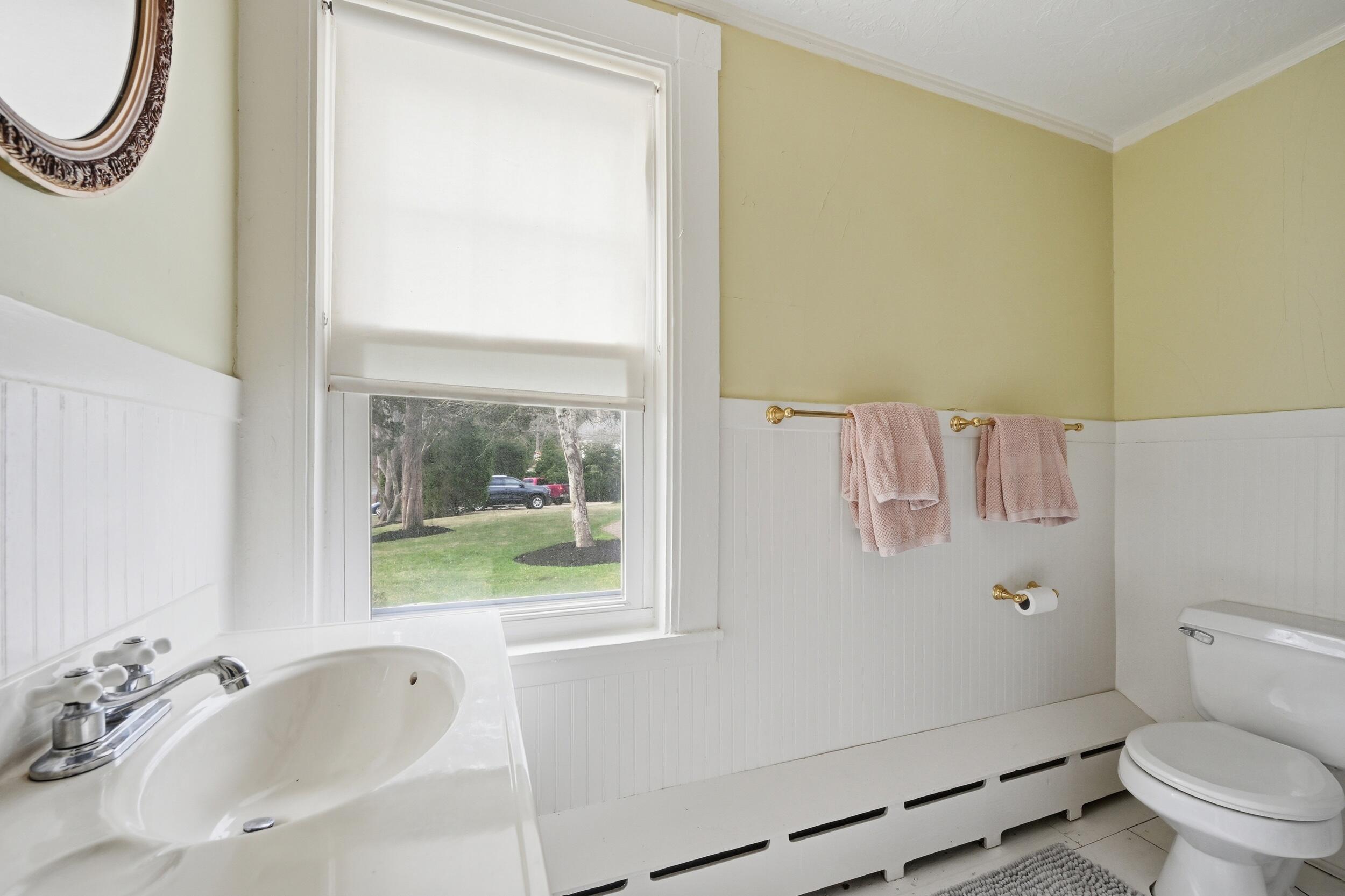 332 South Orleans Road Orleans, MA 02653 - Photo 17 of 42 a white toilet sitting next to a bathroom sink