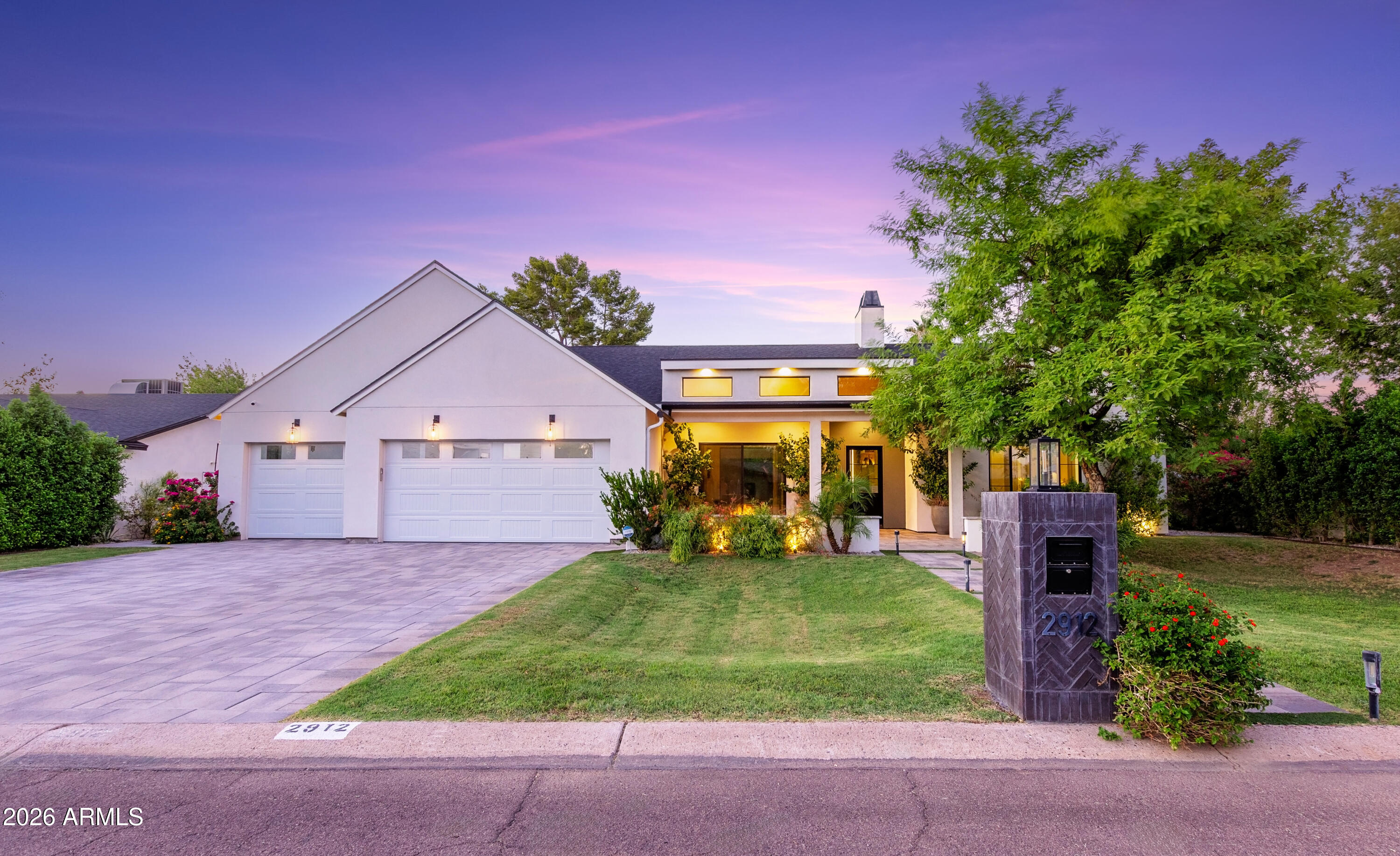 2912 East Pierson Street Phoenix, AZ 85016 - Photo 62 of 86 a front view of a house with a yard and garage