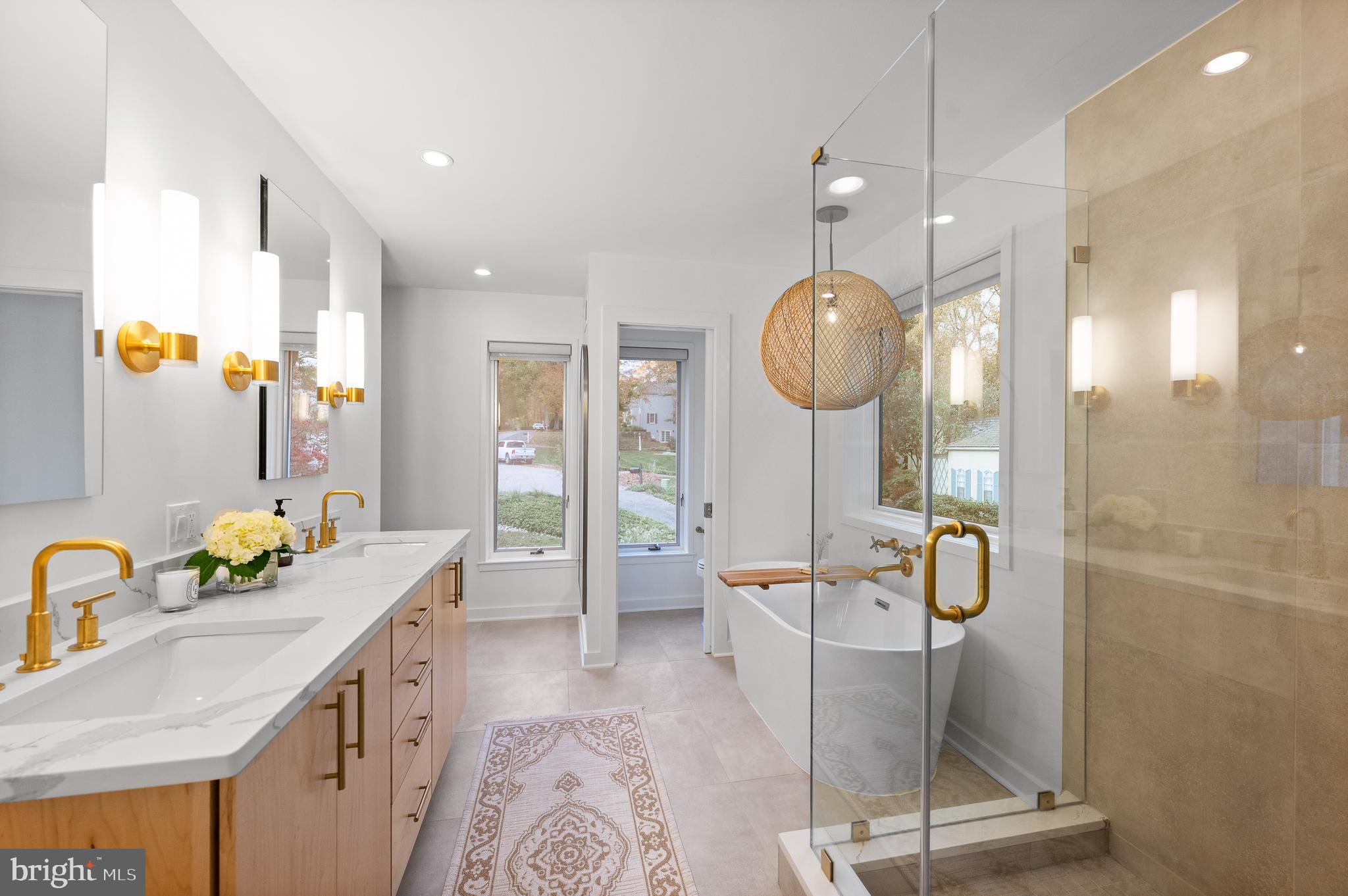 309 Valley Place Radnor, PA 19087 - Photo 16 of 29 a bathroom with a granite countertop sink a toilet a mirror and shower