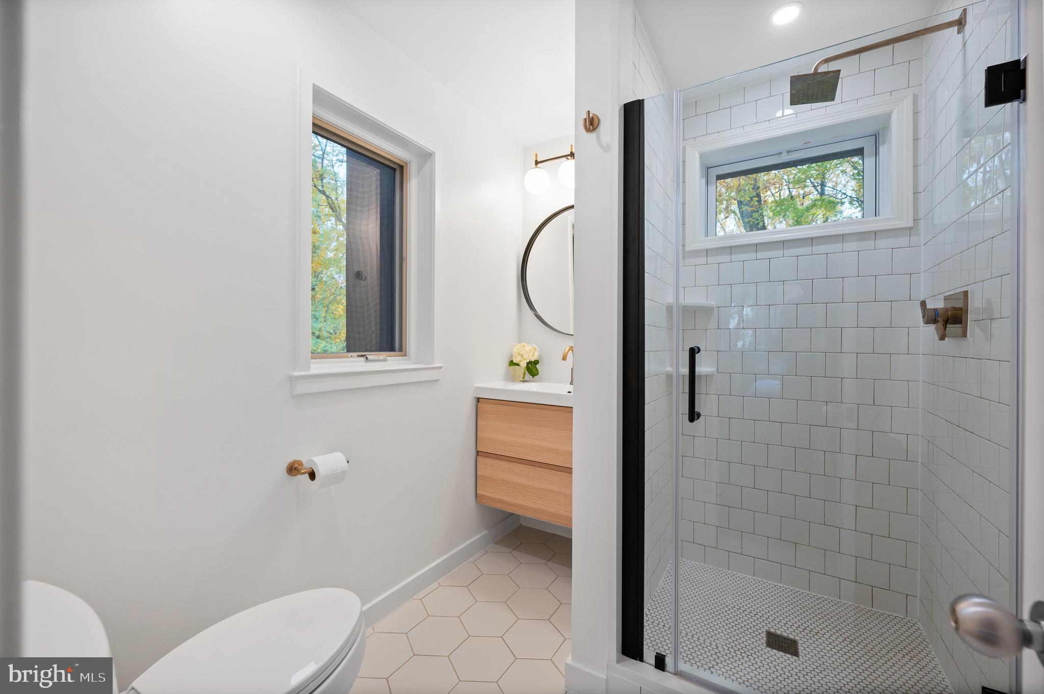 309 Valley Place Radnor, PA 19087 - Photo 23 of 29 a bathroom with a shower a toilet and a sink