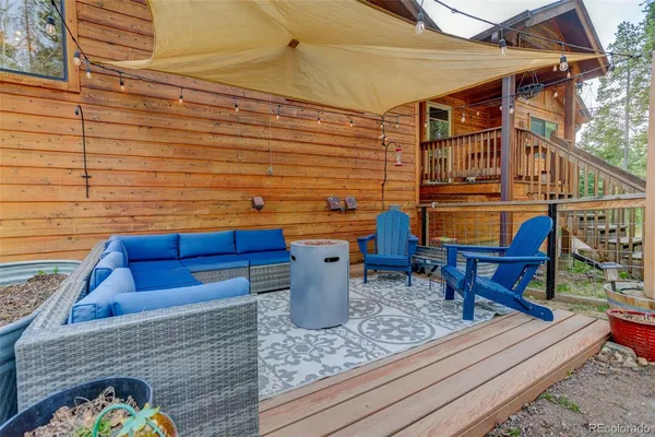 a view of a chairs and table in the patio