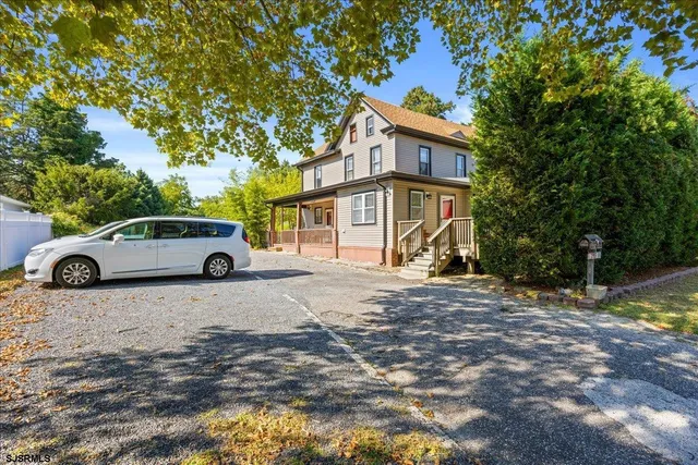 a car parked in front of a house