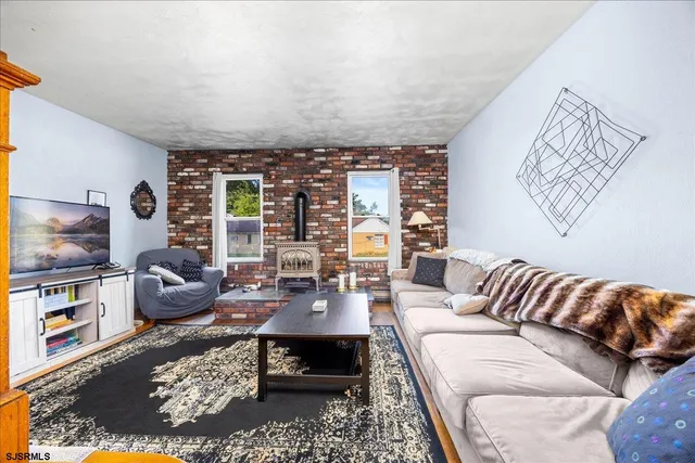 a living room with furniture or couch and a flat screen tv