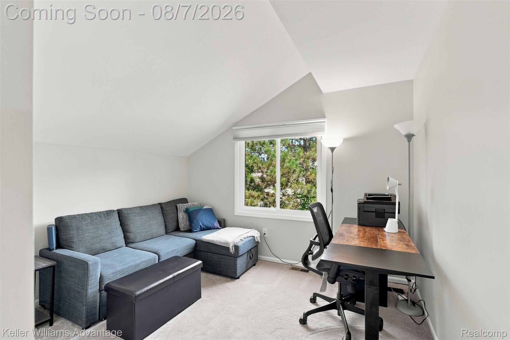 5325 Simpson Lake Road West Bloomfield, MI 48323 - Photo 20 of 43 Sloped ceiling room featuring a window with exterior foliage, light gray wall paint, and light-colored carpeting
