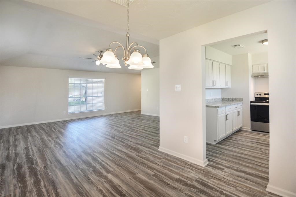 4615 Roserock Lane Spring, TX 77388 - Photo 11 of 21 a view of a kitchen with wooden floor and a window