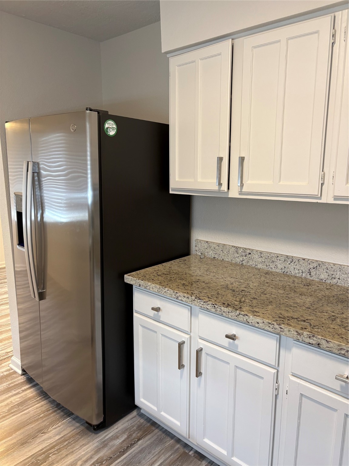 4615 Roserock Lane Spring, TX 77388 - Photo 3 of 21 a kitchen with white cabinets and refrigerator