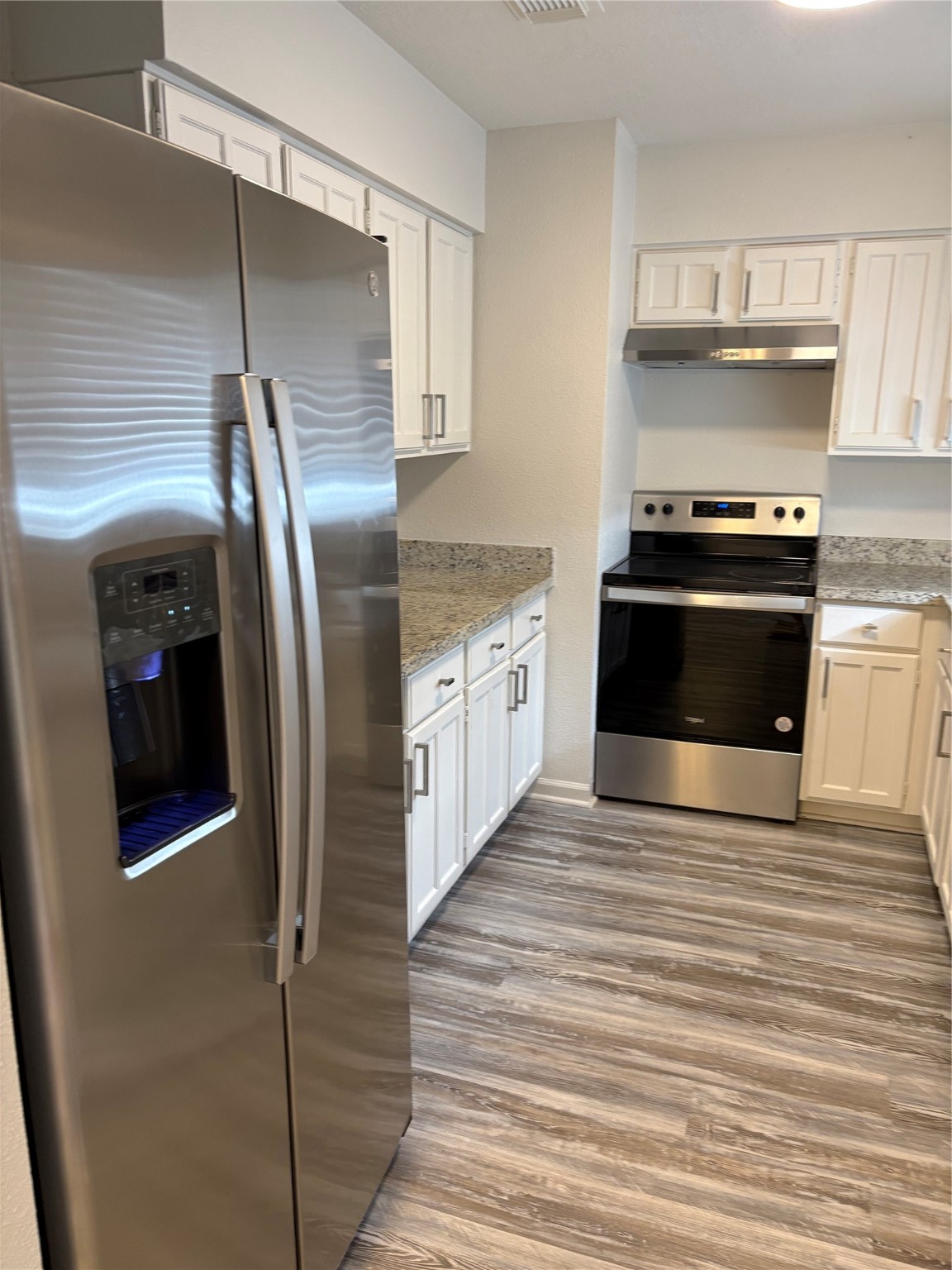 4615 Roserock Lane Spring, TX 77388 - Photo 5 of 21 a kitchen with stainless steel appliances granite countertop a refrigerator and a stove