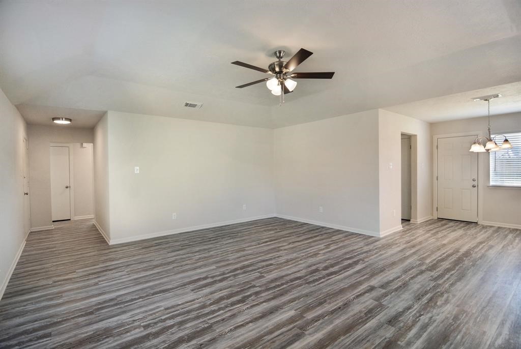 4615 Roserock Lane Spring, TX 77388 - Photo 9 of 21 a view of an empty room and wooden floor