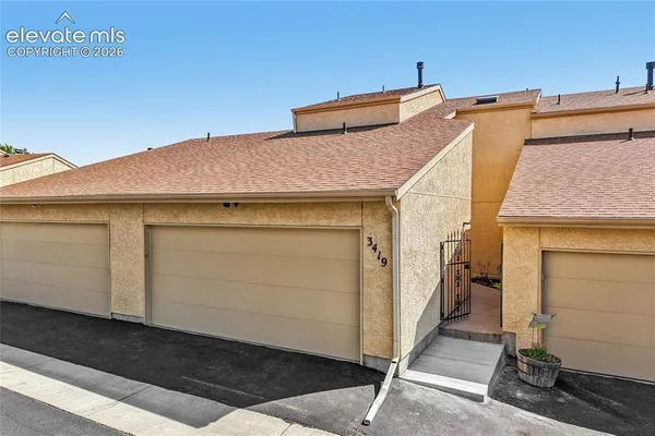 a view of a house with a garage