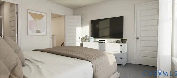 a bedroom with a bed table and flat screen tv