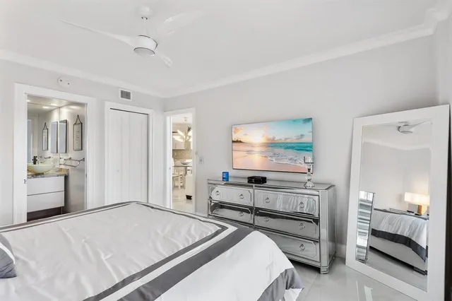 a bedroom with bed and window