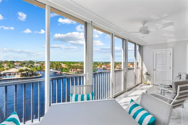 a view of a living room and a balcony