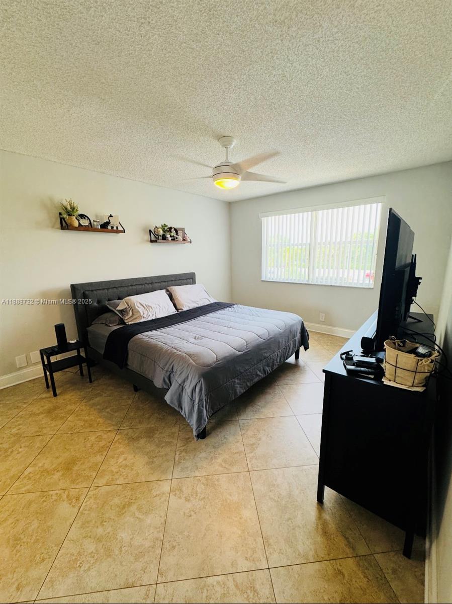 8821 Wiles Road, Unit 305 Coral Springs, FL 33067 - Photo 8 of 30 Master Bedroom