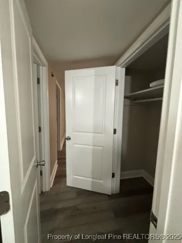 a view of entryway with wooden floor and stair